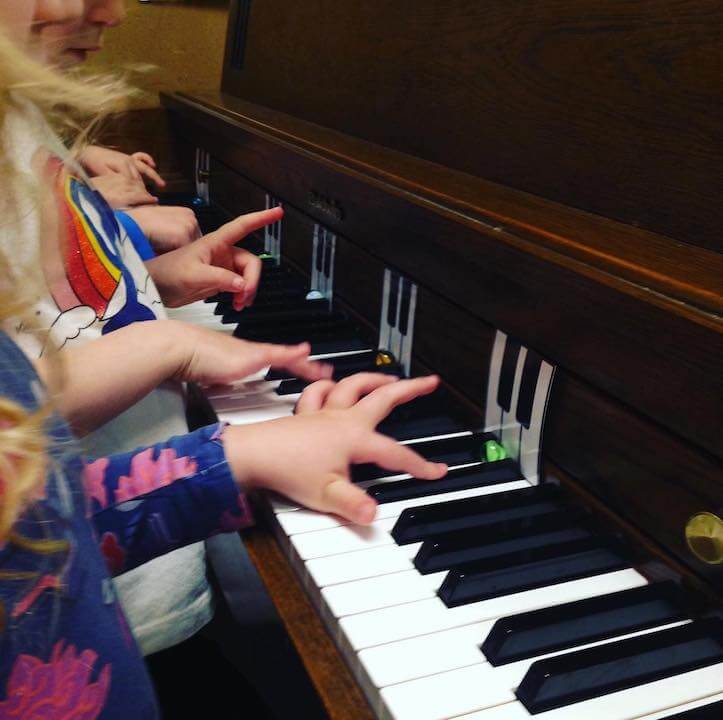 <img src="Group-piano-lessons.jpg" alt="in-person and online group piano lessons play-based learning. ">