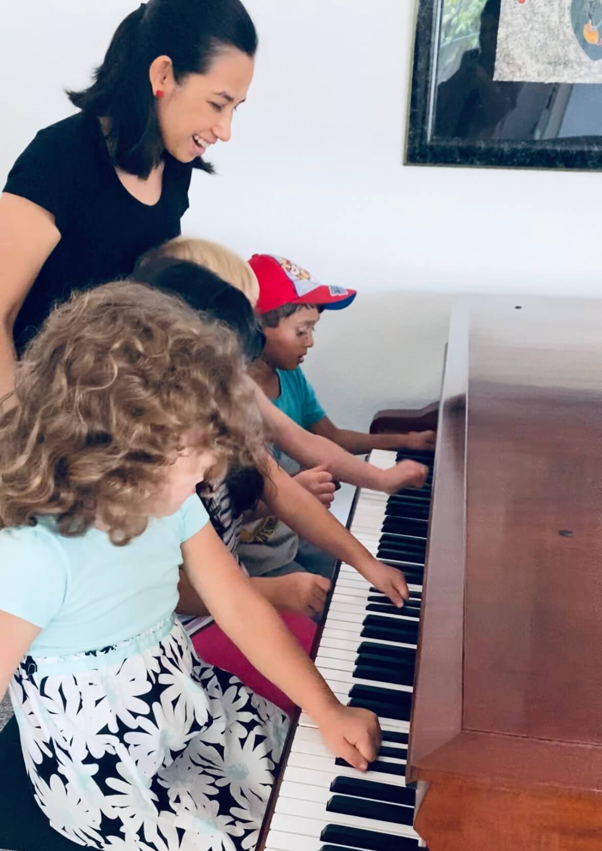 <img src="Engaging-preschool-group-piano-lessons-1.jpeg" alt="Children exploring piano keys while playing. ">